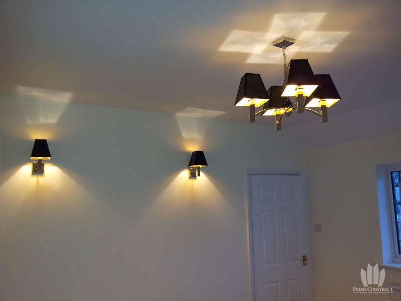 Decorated office with wall lights and ceiling light