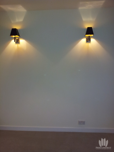Finished wall with two lights