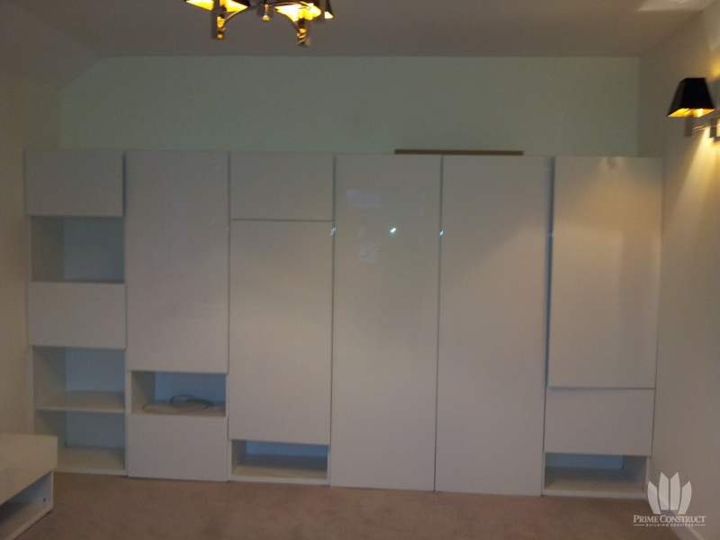 Fitted white storage wall