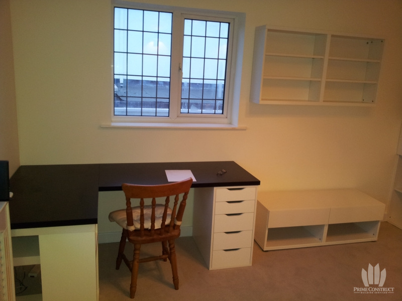 Built-in desk and shelving beside window