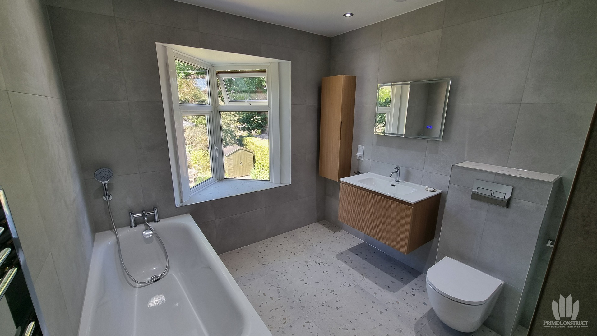 Bath, open window, vanity and wall-hung WC