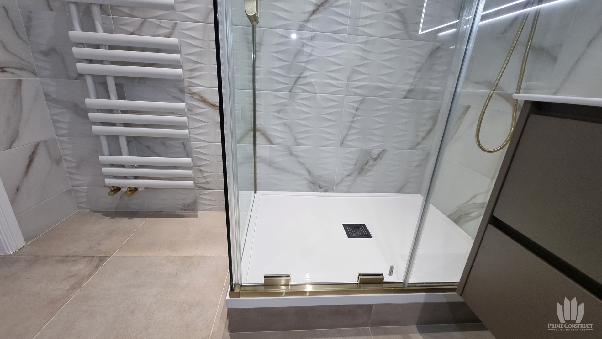 Of raised shower plinth, tray, glass hardware and towel radiator. Proposed key image explaining the raised-shower feature.