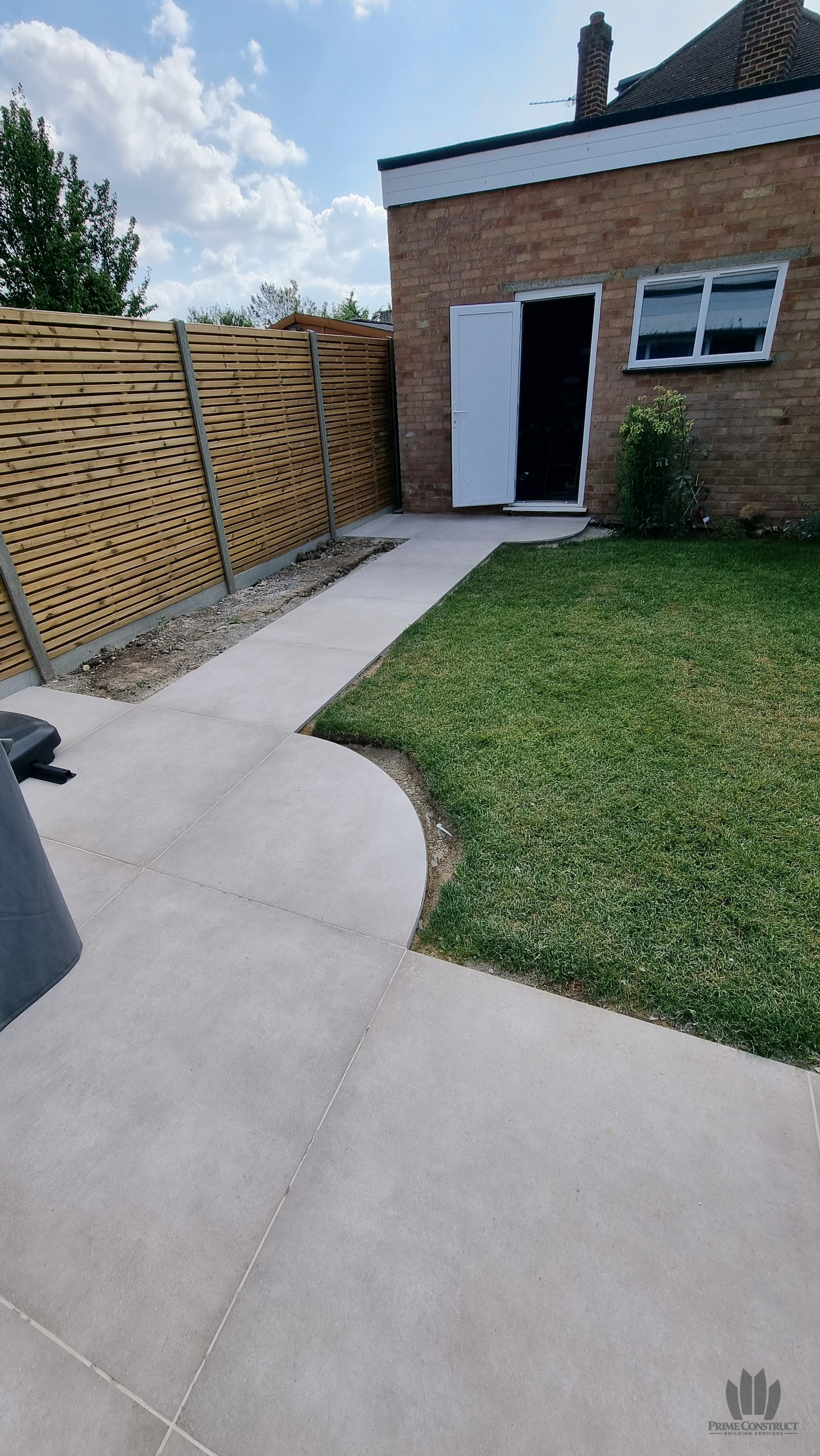 New paving, lawn edge and boundary fence