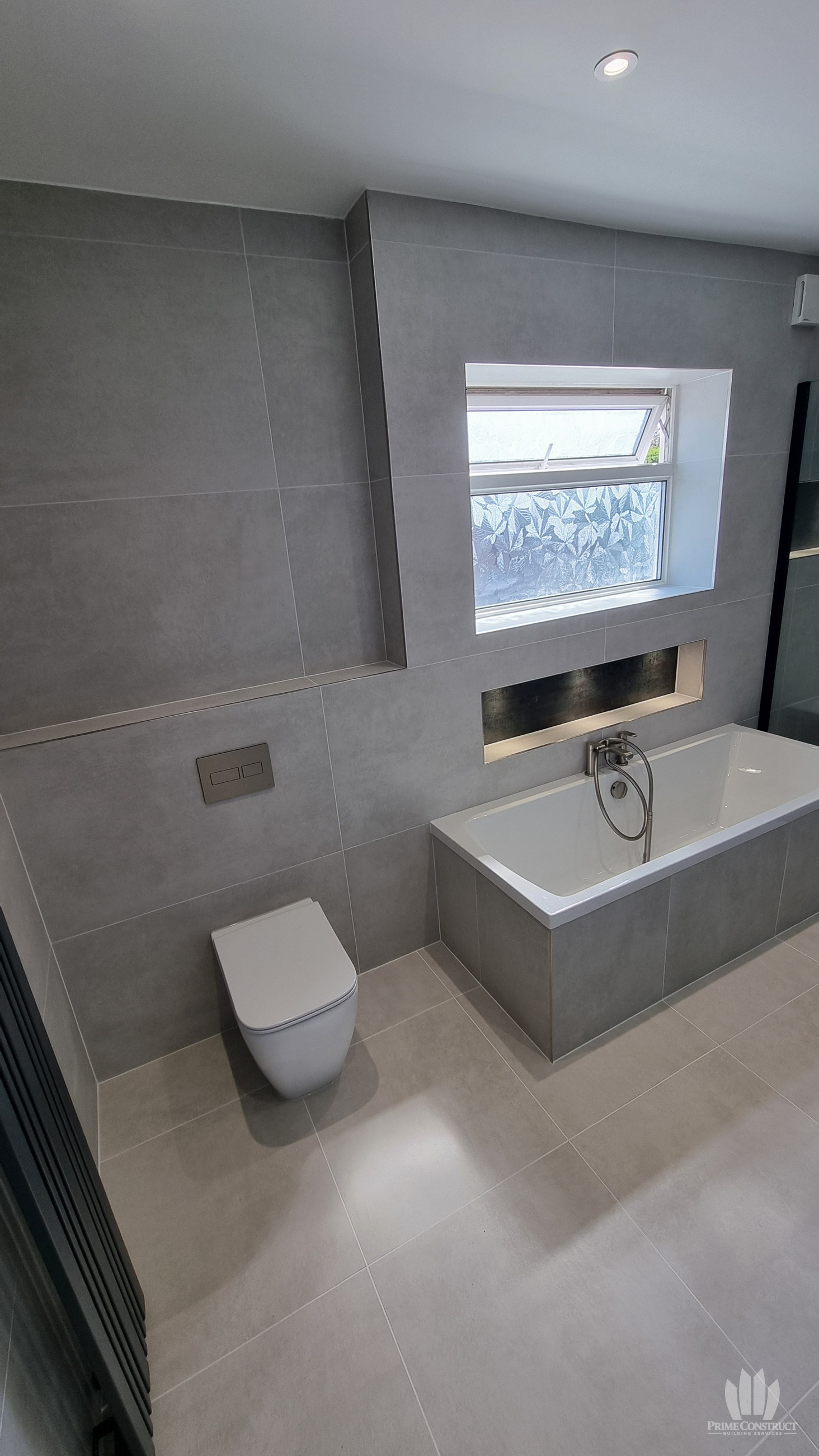 Finished WC and bath/window wall
